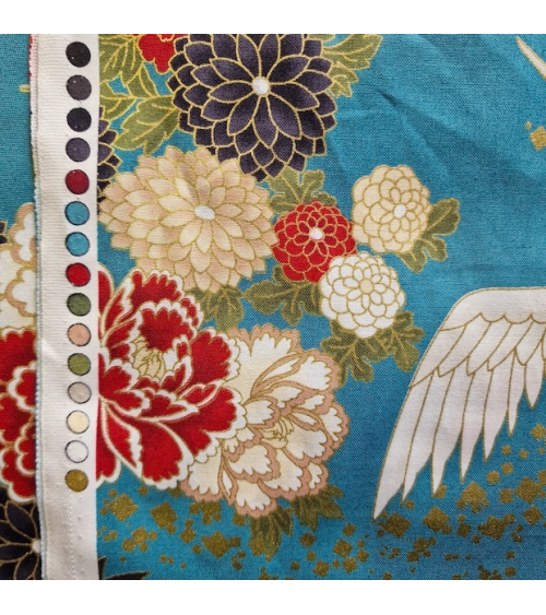 Japanese fabric. Flying Cranes and flowers in greenish blue.