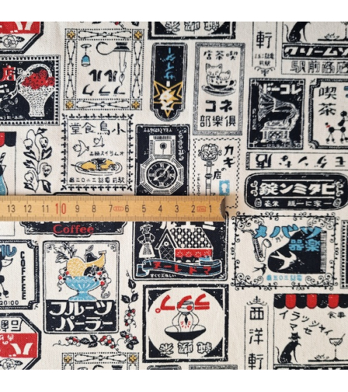 Japanese canvas fabric Retro Labels in natural white. 100% cotton.