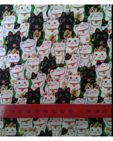 Japanese dobby fabric. Maneki neko over green