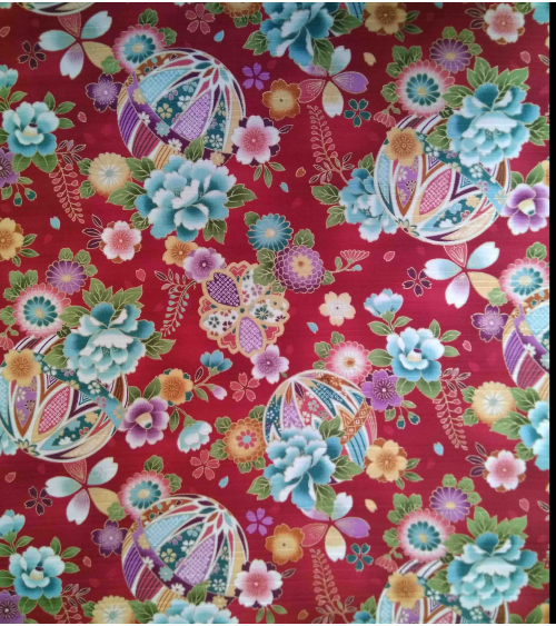Satin fabric with temari over carmine red background