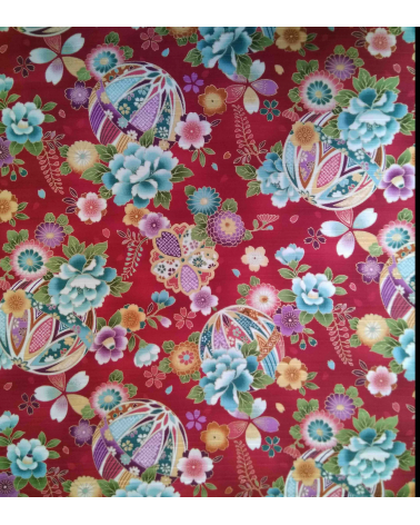 Satin fabric with temari over carmine red background