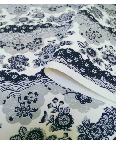 Chiyogami paper. Grey waves and flowers over off-white.