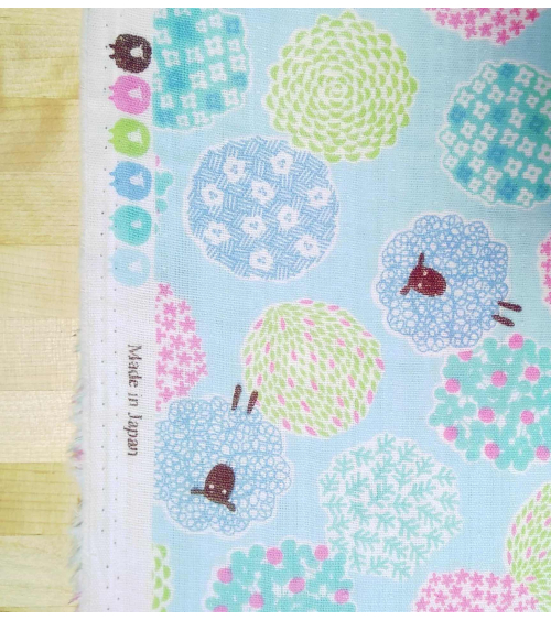 Little sheeps over blue. Japanese double gauze