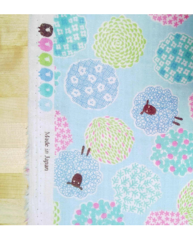 Little sheeps over blue. Japanese double gauze