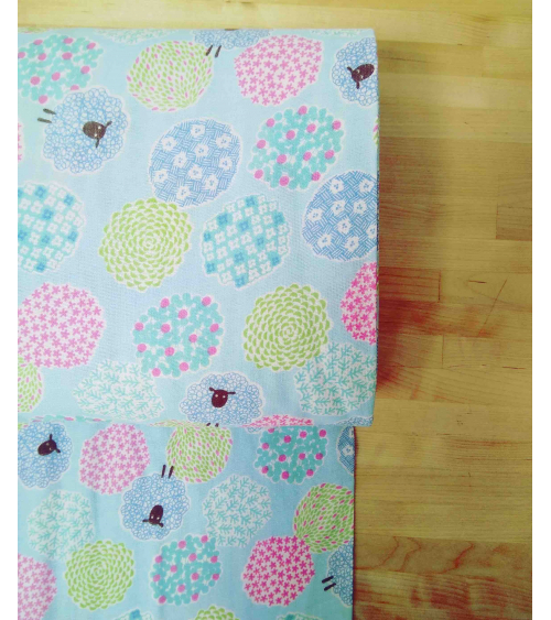 Little sheeps over blue. Japanese double gauze