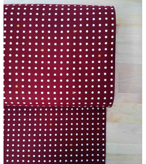 Japanese cotton fabric. Polka dots over maroon.
