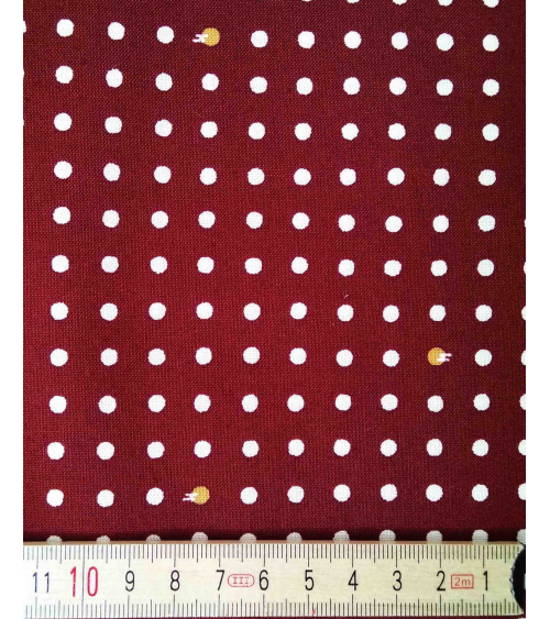 Tela japonesa de algodón. Lunares sobre castaño rojizo.