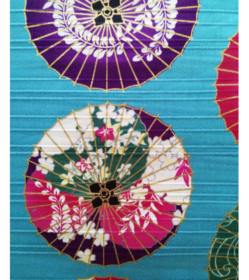 Cotton satin fabric. Paper umbrellas over turquoise-blue background.