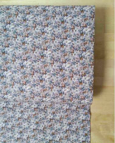 Embossed cotton fabric. Little flowers in muted colors.