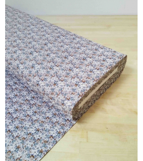 Embossed cotton fabric. Little flowers in muted colors.
