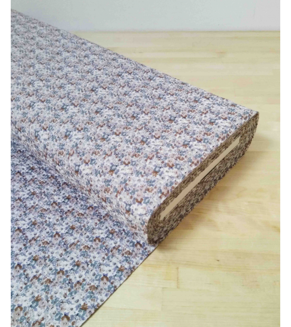 Embossed cotton fabric. Little flowers in muted colors.