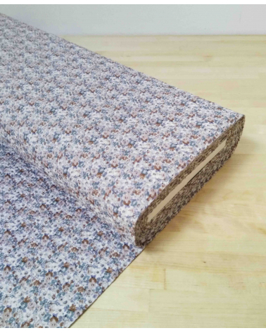 Embossed cotton fabric. Little flowers in muted colors.