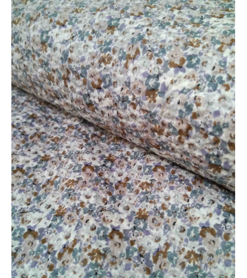 Embossed cotton fabric. Little flowers in muted colors.