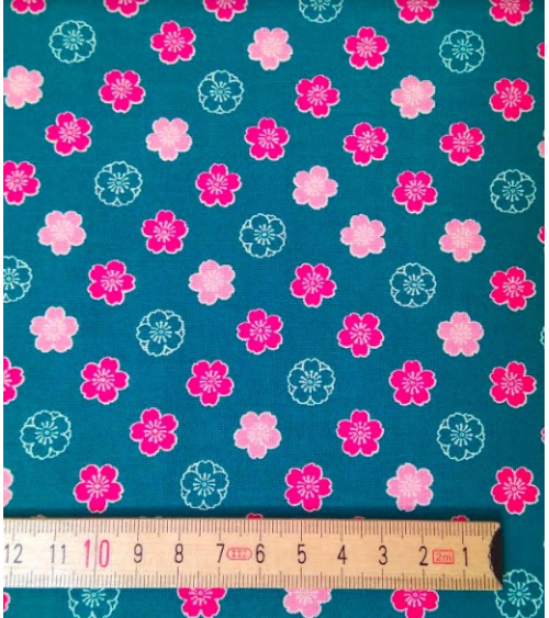 Japanese cotton fabric. Sakura flowers over blue
