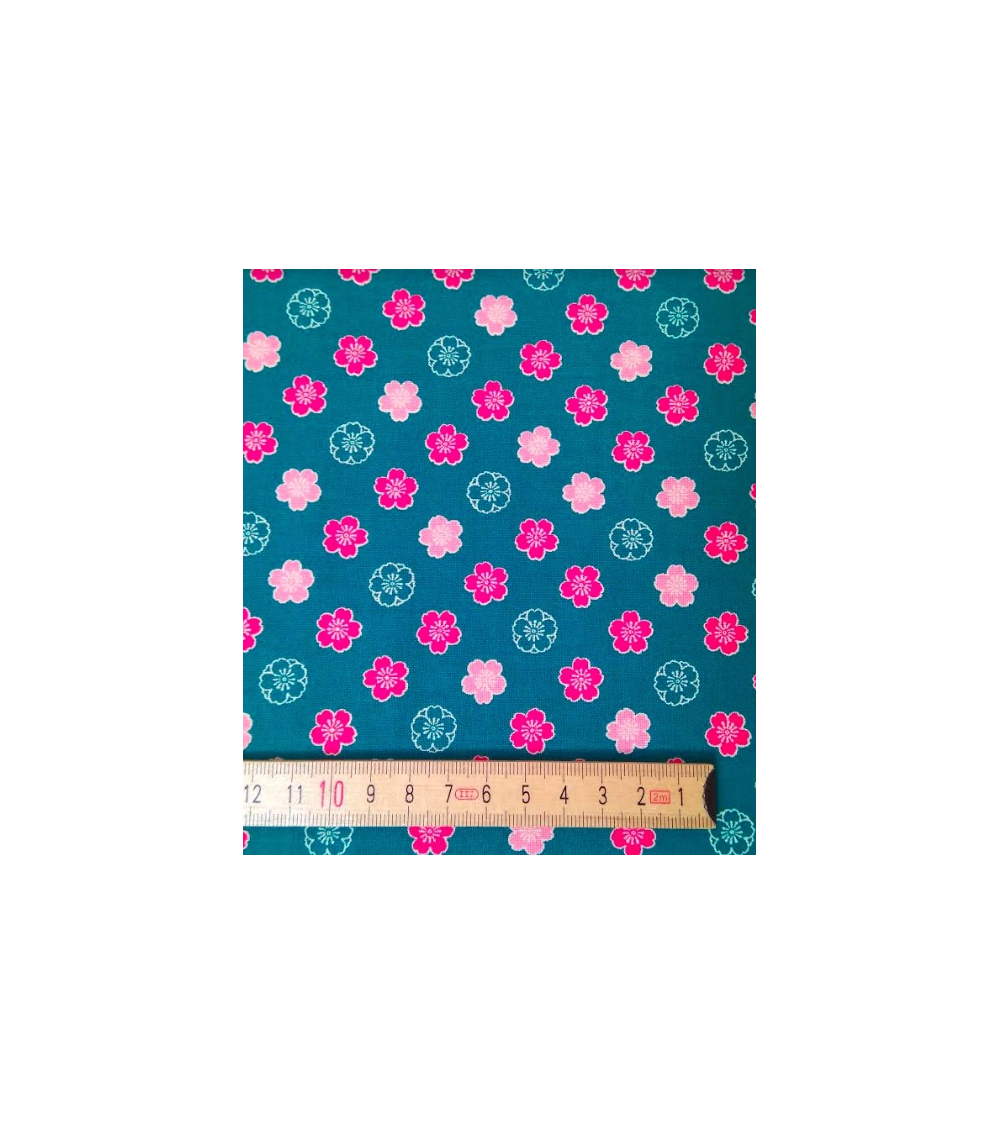 Japanese cotton fabric. Sakura flowers over blue