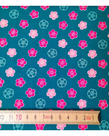 Japanese cotton fabric. Sakura flowers over blue