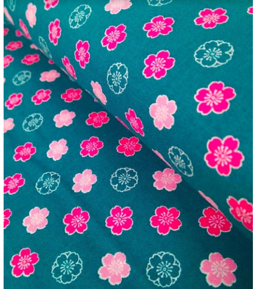 Japanese cotton fabric. Sakura flowers over blue