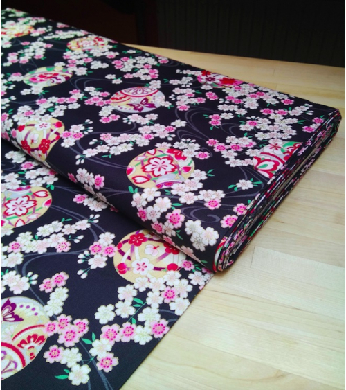 Japanese fabric. Sakura and temari over black.