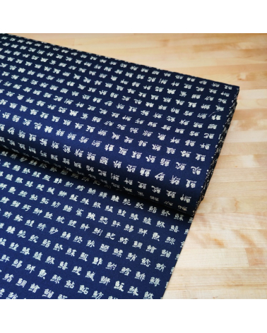 Japanese cotton fabric. Kanjis "names of fishes" on blue.