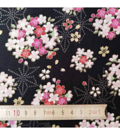 Japanese fabric with sakuras and asanoha on a black background.
