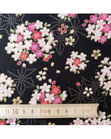 Japanese fabric with sakuras and asanoha on a black background.