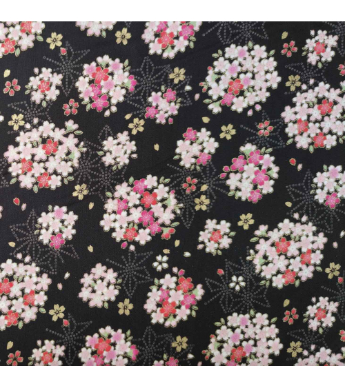 Japanese fabric with sakuras and asanoha on a black background.