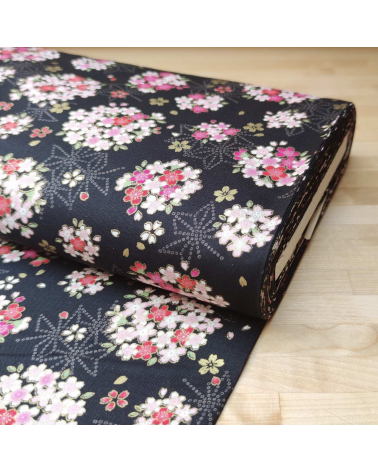 Japanese fabric with sakuras and asanoha on a black background.