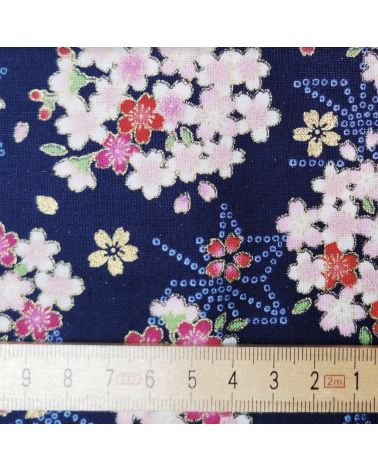 Japanese fabric with sakuras and asanoha on a blue background.