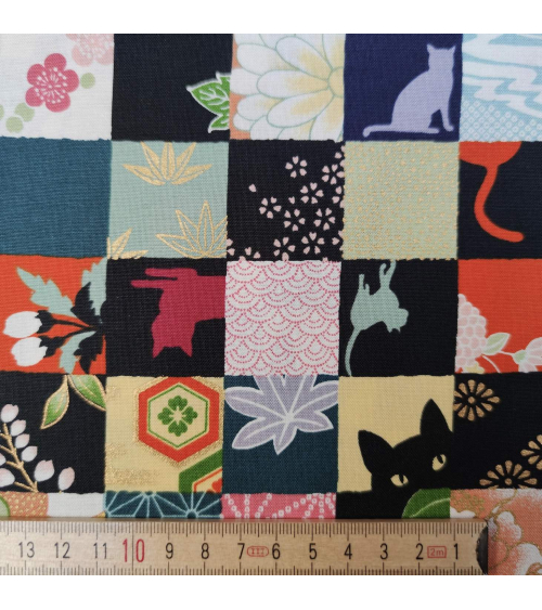 Tela japonesa. Patchwork Gato en colores brillantes.