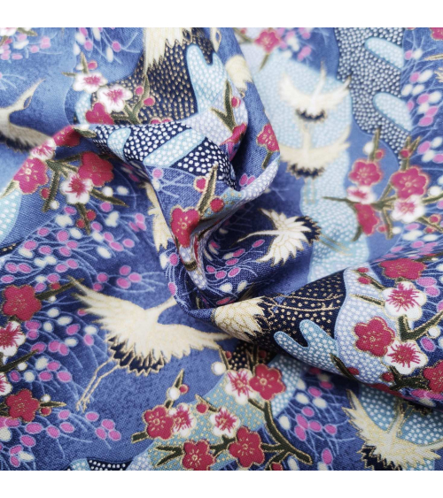 Japanese cotton fabric of cranes and ume with golden details.