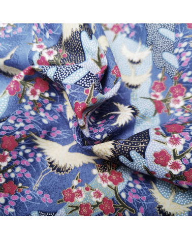 Japanese cotton fabric of cranes and ume with golden details.