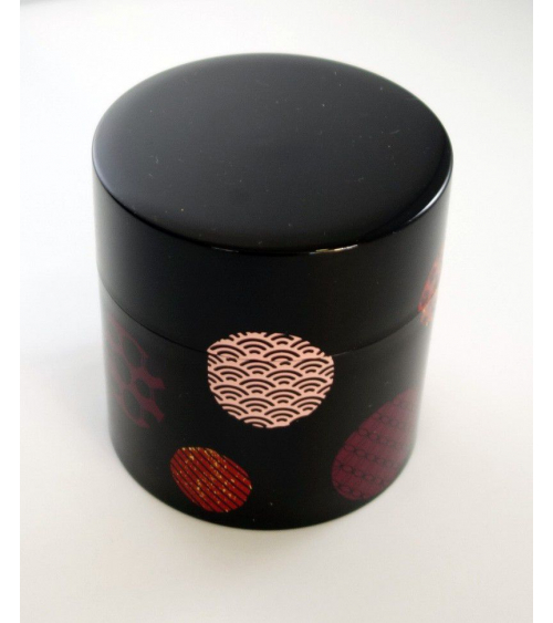 Bote para té con círculos con motivos japoneses y fondo negro