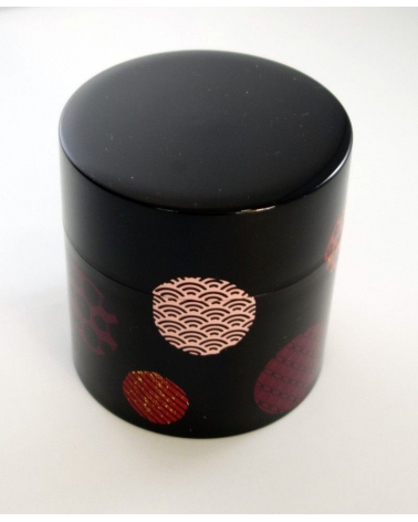 Bote para té con círculos con motivos japoneses y fondo negro
