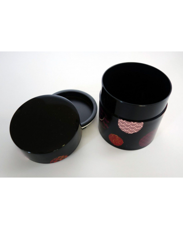 Bote para té con círculos con motivos japoneses y fondo negro