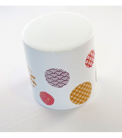 Bote para té con círculos con motivos japoneses y fondo blanco
