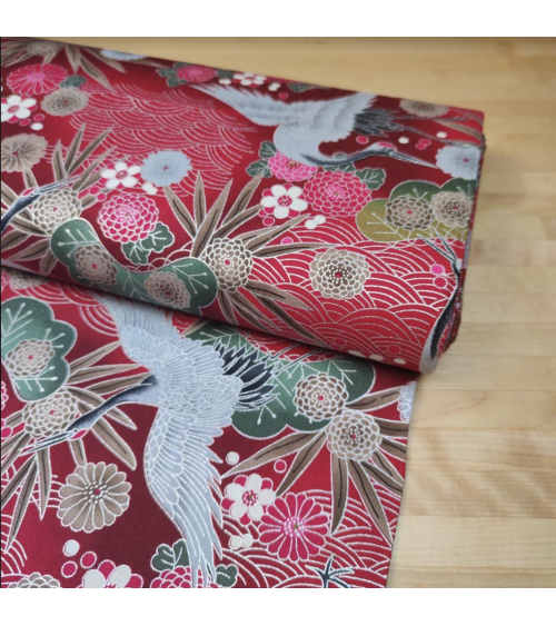 Japanese cotton fabric of cranes in red with silver details.