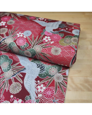 Japanese cotton fabric of cranes in red with silver details.