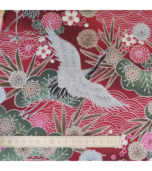 Japanese cotton fabric of cranes in red with silver details.