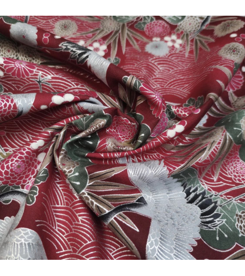 Japanese cotton fabric of cranes in red with silver details.