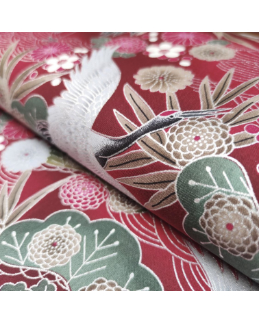Japanese cotton fabric of cranes in red with silver details.