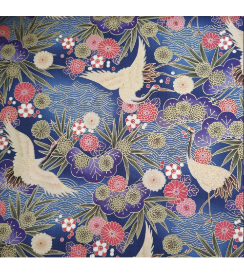 Japanese cotton fabric of cranes in blue with golden details.