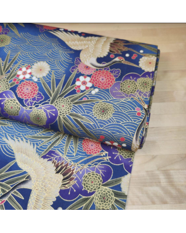 Japanese cotton fabric of cranes in blue with golden details.