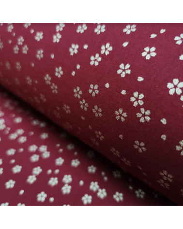 Tela japonesa de algodón rojo cereza con sakuras doradas