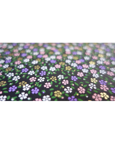 Papel japonés chiyogami alegres florecillas sobre fondo negro
