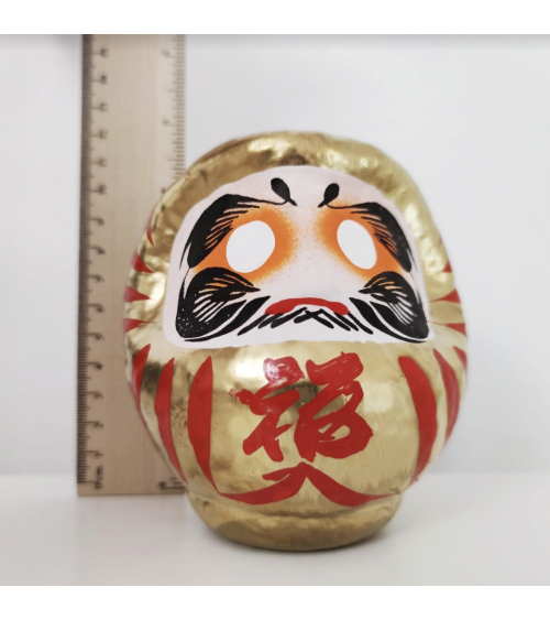 Amuleto daruma dorado 12 cm.