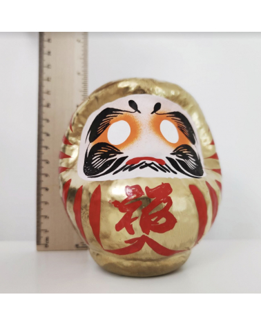 Amuleto daruma dorado 12 cm.