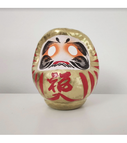 Amuleto daruma dorado 12 cm.