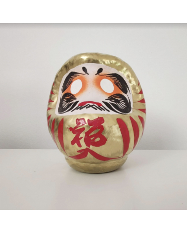 Amuleto daruma dorado 12 cm.