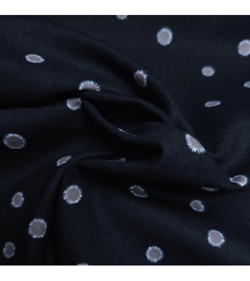 Japanese cotton-linen fabric with irregular polka dots over black background