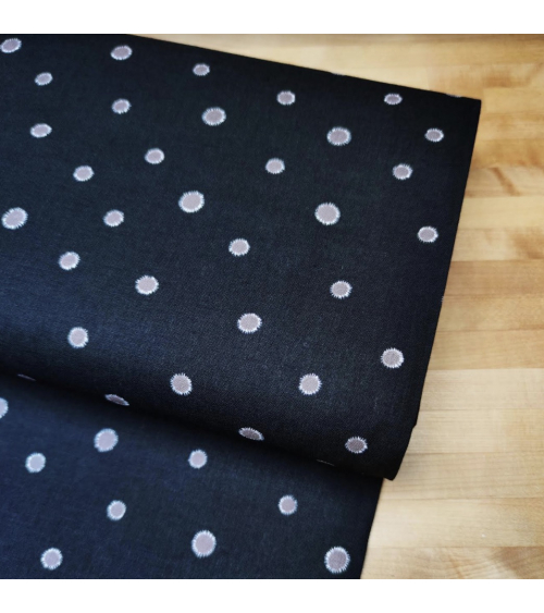 Japanese cotton-linen fabric with irregular polka dots over black background
